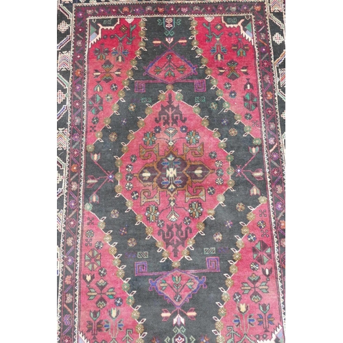 1127 - A red ground full pile Afghan Baluch tribal rug, 47