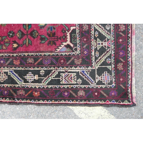 1127 - A red ground full pile Afghan Baluch tribal rug, 47