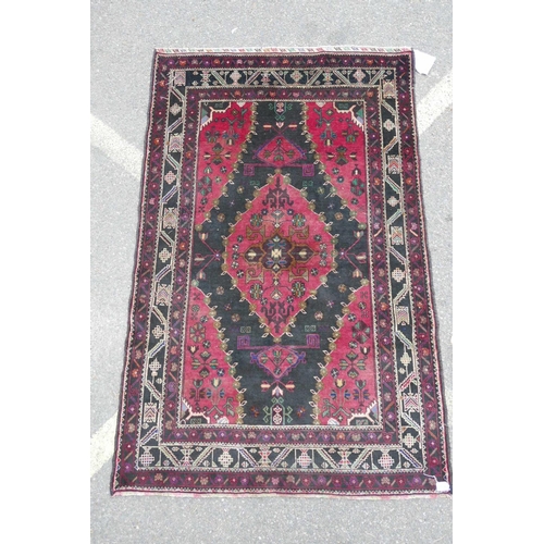 1127 - A red ground full pile Afghan Baluch tribal rug, 47