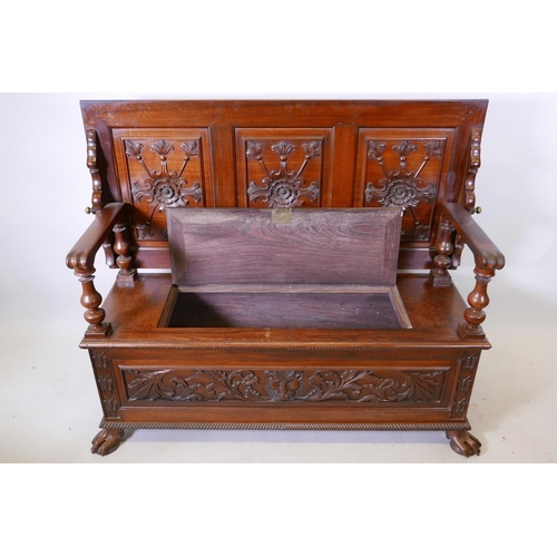 1111 - A Colonial, Anglo-Indian rosewood monk's bench, the three panelled back with carved decoration, and ... 