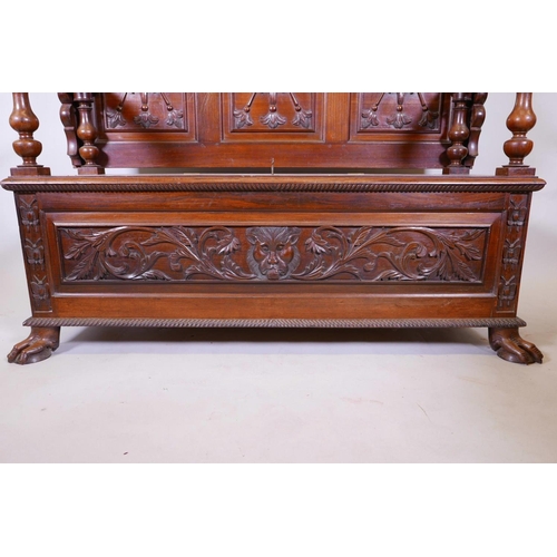 1111 - A Colonial, Anglo-Indian rosewood monk's bench, the three panelled back with carved decoration, and ... 