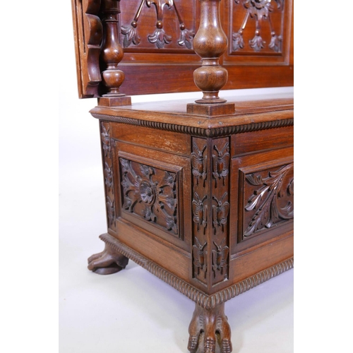 1111 - A Colonial, Anglo-Indian rosewood monk's bench, the three panelled back with carved decoration, and ... 