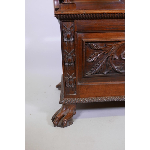 1111 - A Colonial, Anglo-Indian rosewood monk's bench, the three panelled back with carved decoration, and ... 