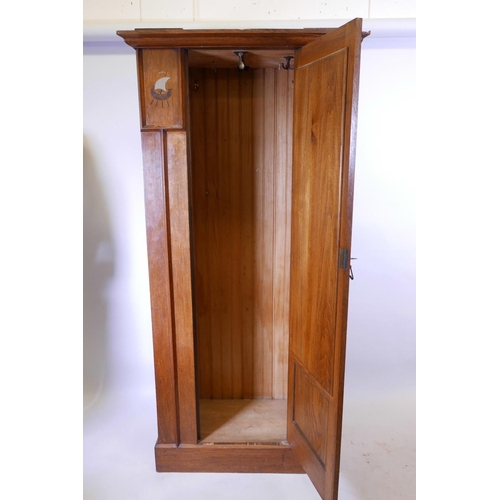 1119 - A Harris Lebus oak hall cupboard/wardrobe with pewter and exotic wood inlaid decoration, 37