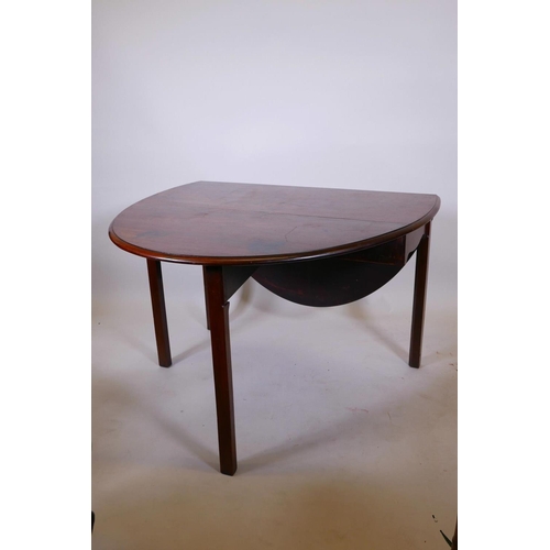 1113 - A Georgian mahogany drop leaf table, raised on chamfered supports, 44