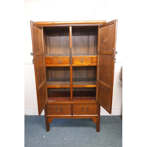 1125 - A C19th Chinese elm marriage cabinet, fitted with drawers, 41