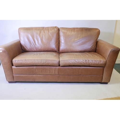 1120 - A two seater leather upholstered sofa, 78