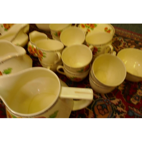 560 - An extensive vintage Art Deco Crown Ducal Marigold pattern dinner, tea and breakfast service compris... 