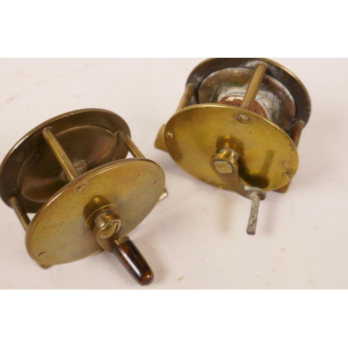 102 - Two small vintage brass trout fishing reels, 2