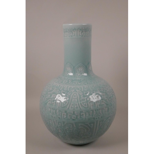 103 - A Chinese duck egg blue glazed pottery vase with archaic style underglaze decoration, 6 character ma... 