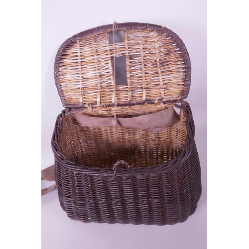 104 - A vintage woven wicker fishing basket, 11