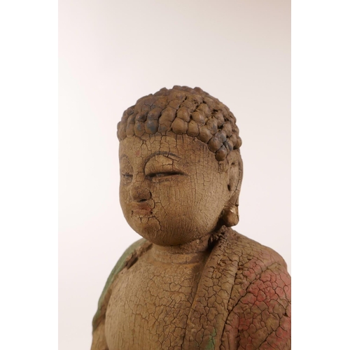 105 - A Chinese carved and painted figure of Buddha, 12