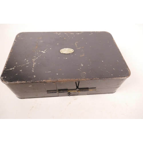 107 - A vintage Hardy Bros black metal lure box with fitted interior compartments, 7½