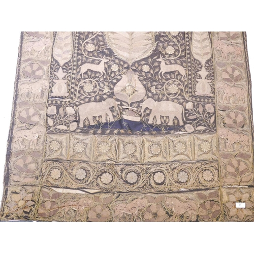 11 - An Indian gilt thread embroidered wall hanging with rosettes, elephants and tiger decoration, A/F fr... 