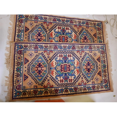 1107 - A pair of Oriental pattern Belgian wool rugs with beige ground, 60