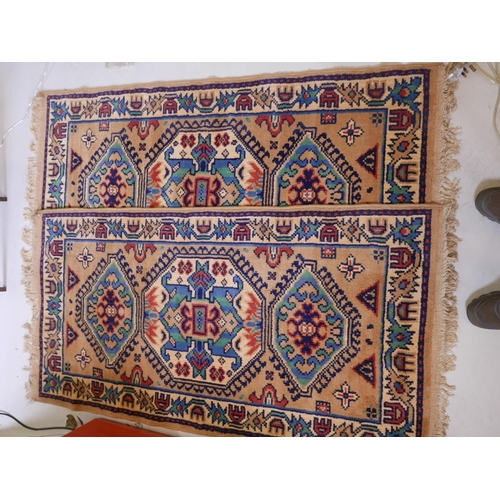 1107 - A pair of Oriental pattern Belgian wool rugs with beige ground, 60