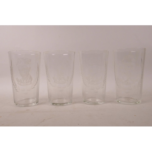 111 - A collection of four etched high ball glasses decorated with portraits of Churchill, Montgomery, Sta... 