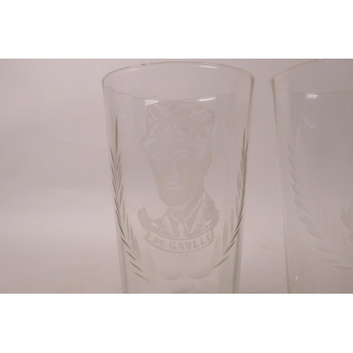 111 - A collection of four etched high ball glasses decorated with portraits of Churchill, Montgomery, Sta... 