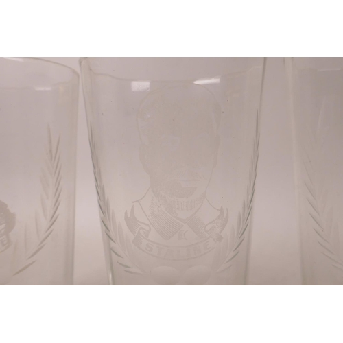 111 - A collection of four etched high ball glasses decorated with portraits of Churchill, Montgomery, Sta... 