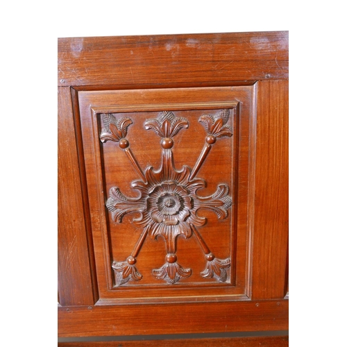 1111 - A Colonial, Anglo-Indian rosewood monk's bench, the three panelled back with carved decoration, and ... 