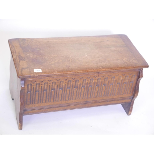 1116 - A small oak coffer, with carved front, 30