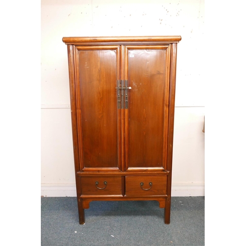 1125 - A C19th Chinese elm marriage cabinet, fitted with drawers, 41