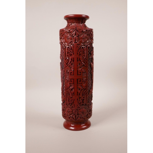 113 - A Chinese Cinnabar lacquer style cylinder vase with decorative panels, seal mark to base, 12½