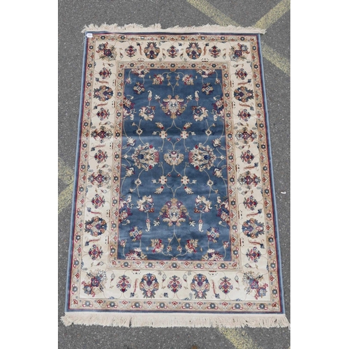 1132 - A Kashmiri duck egg blue rug decorated with a Ziegler design to centre and cream ground border, 51