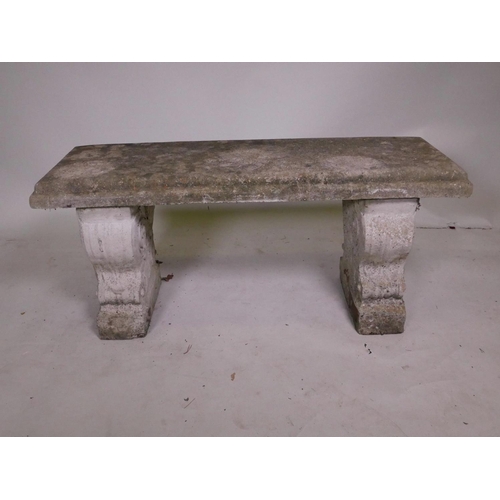 1136 - A weathered concrete garden bench, 40