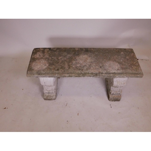 1136 - A weathered concrete garden bench, 40