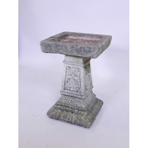 1140 - A weathered concrete bird bath, 22