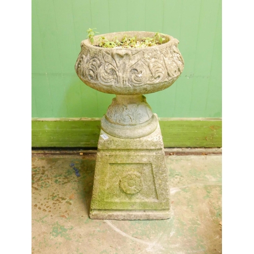 1141 - A weathered concrete garden urn on pedestal, 28