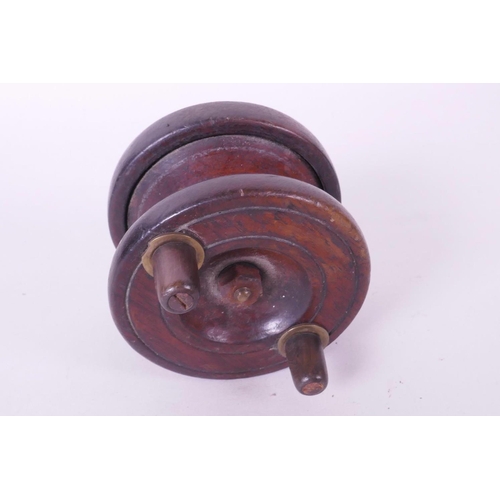 119 - A vintage English made wooden fishing reel with brass foot, 2½