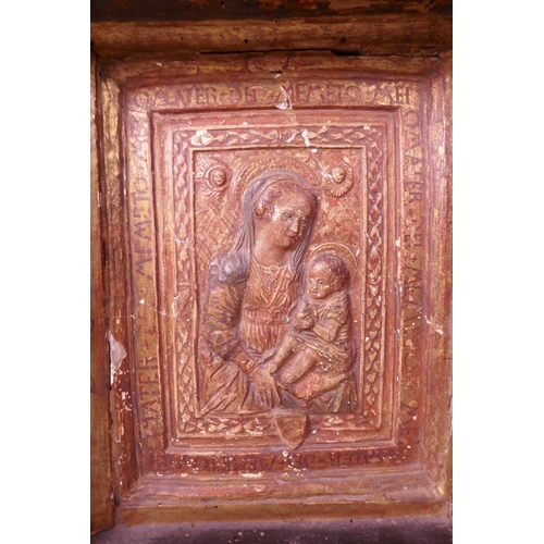 140 - A C15th Italian Renaissance gilded and painted pastiglia relief of the Madonna and Child, after Desi... 