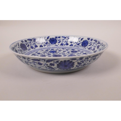 148 - A Chinese blue and white porcelain dish, with scrolling lotus flower decoration, seal mark to base, ... 