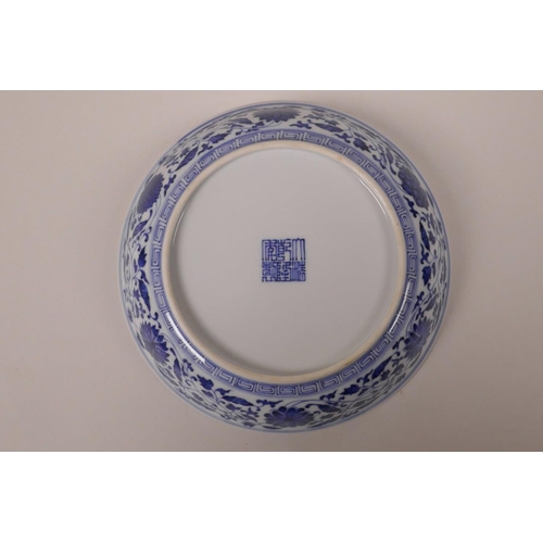 148 - A Chinese blue and white porcelain dish, with scrolling lotus flower decoration, seal mark to base, ... 