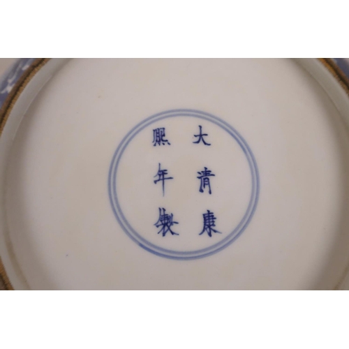 155 - A Chinese blue and white porcelain cabinet plate with a dragon chasing the flaming pearl, 6 characte... 