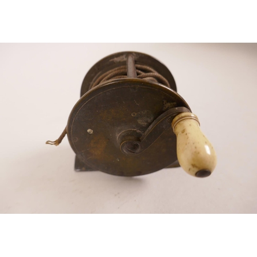 17 - A C19th brass trout fishing reel, 2⅜