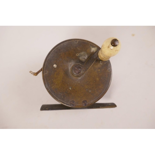 17 - A C19th brass trout fishing reel, 2⅜