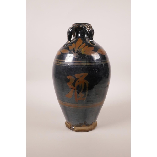 173 - A Chinese Cizhou kiln pottery vase decorated with Chinese characters, 10½