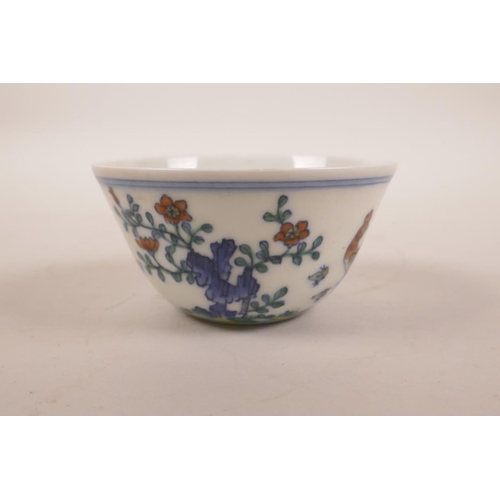 180 - A Chinese doucai porcelain tea bowl with chicken decoration, seal mark to base, 3