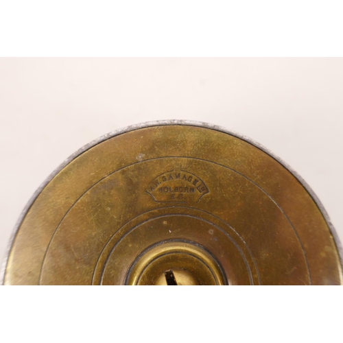 181 - A small vintage brass trout fishing reel stamped A.W. Gamage Ltd, London, 2¼