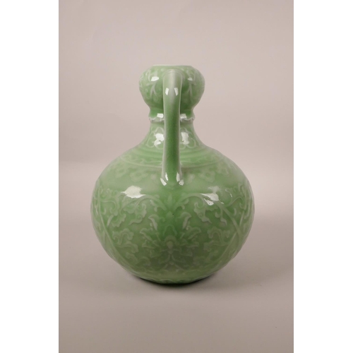 198 - A Chinese green glazed porcelain garlic head flask with two handles and underglaze lotus flower deco... 