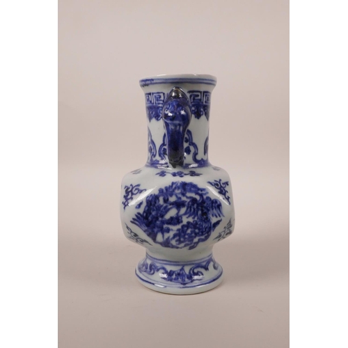 203 - A small Chinese blue and white pottery vase with two elephant mask handles and phoenix decoration, 6... 