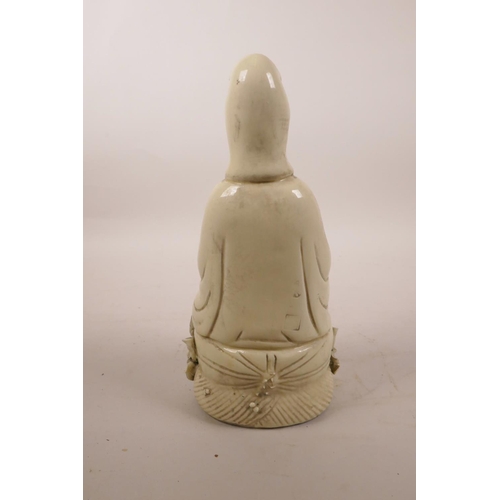 205 - A Chinese blanc de chine figure of Quan Yin seated on a lotus throne, impressed marks verso, 10½