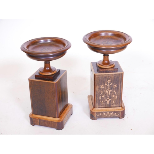 211 - A pair of rosewood and boxwood inlaid urns on stands, 10