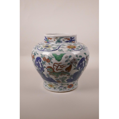 218 - A Chinese doucai pottery jardiniere decorated with kylin and fo dogs, 6 character mark to side, 8½