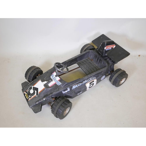 224 - A child's retro plastic pedal racing car, 40