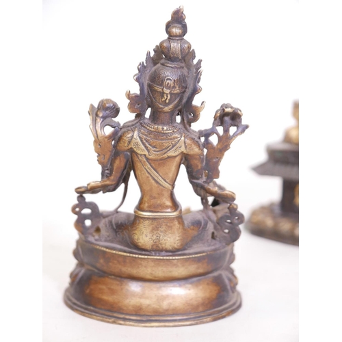 236 - A patinated brass figure of Buddha seated upon a lotus throne, and set on a parcel gilt stand, figur... 