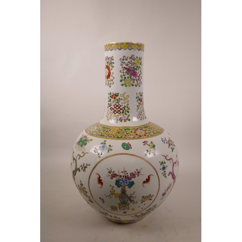 240 - A Chinese polychrome porcelain vase decorated with the Eight Buddhist Treasures to the neck and drag... 